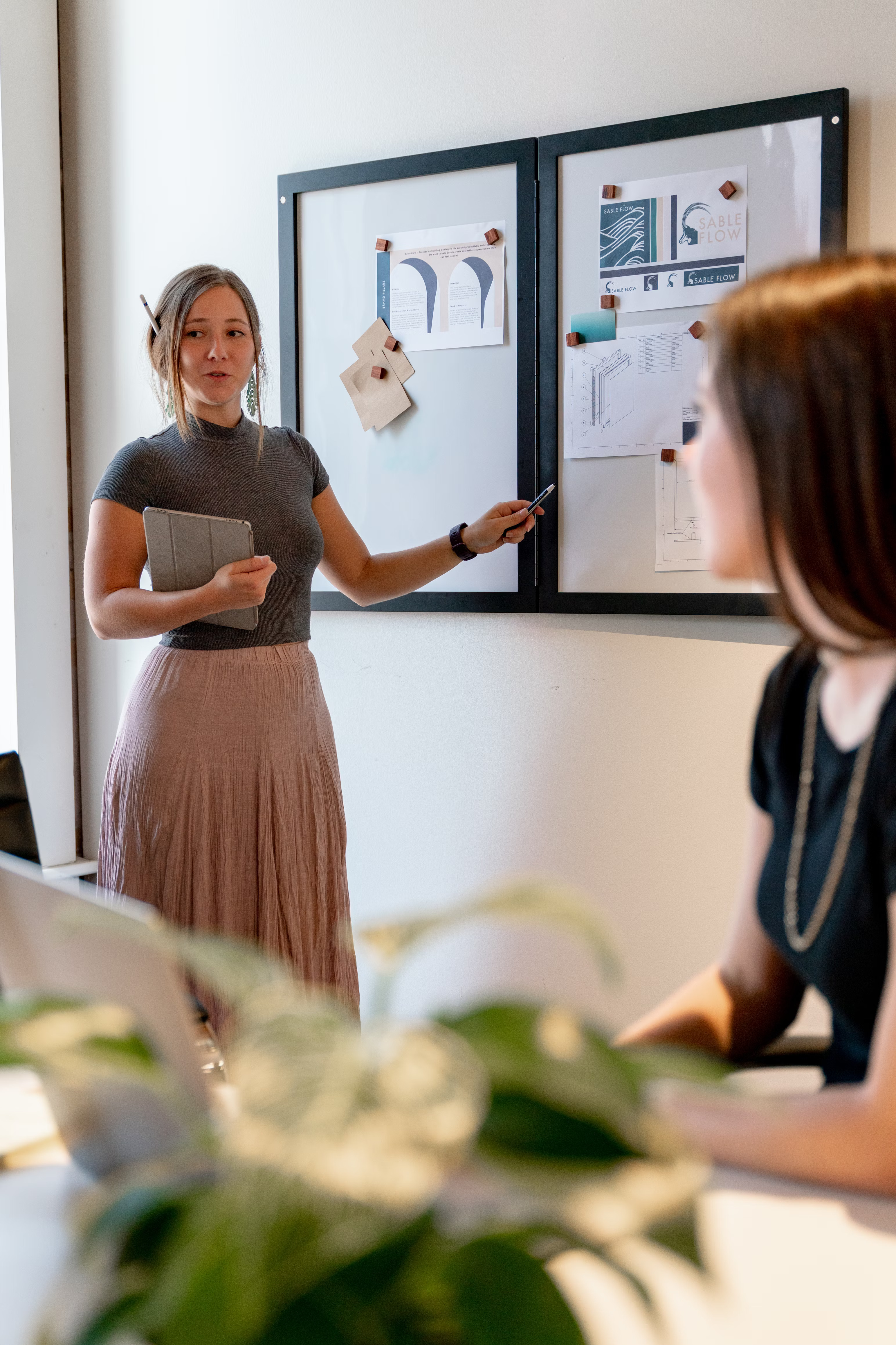 woman giving whiteboard presentation